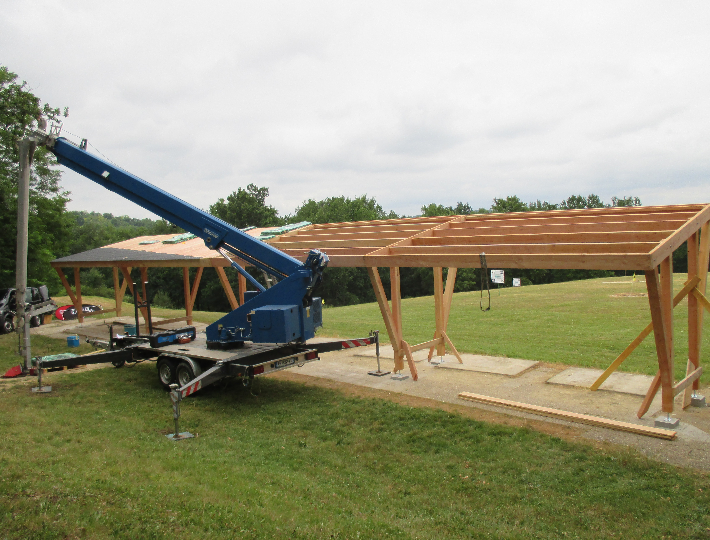 Photo: Construction d'un carport solaire en bois pour un Golf